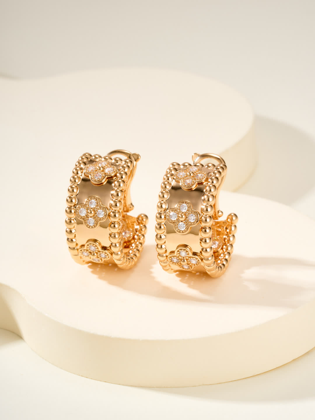 Van Cleef & Arpels Elegant Gold and Silver Hoop Earrings with Diamond Accents